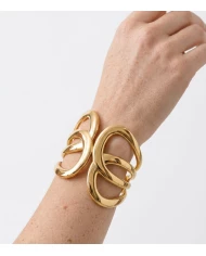 Brazalete Alma Dorado — diseño escultórico minimalista con acabado premium Brazalete Alma Dorado — diseño escultórico minimalista con acabado premium