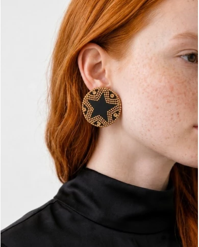 Pendientes Black Star — diseño geométrico en dorado y negro