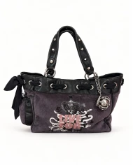 Bolso Juicy Couture Live For — un diseño con actitud y personalidad.